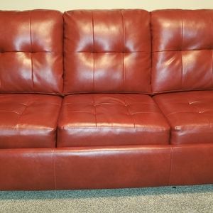 Red leather pullout couch